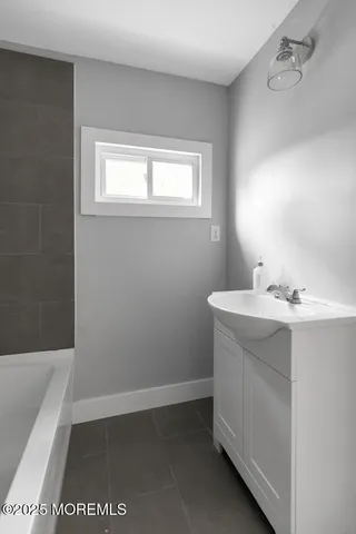 a bathroom with a sink a toilet and a bathtub