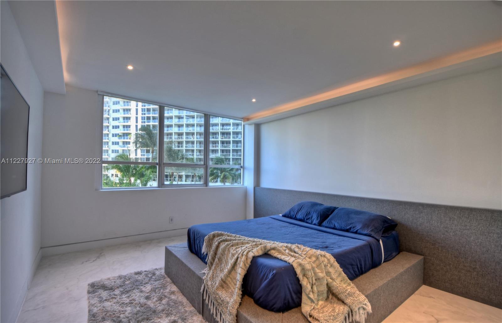 1500 Bay Road, Unit 364S Miami Beach, FL 33139 - Photo 12 of 28 a spacious bedroom with a bed and window
