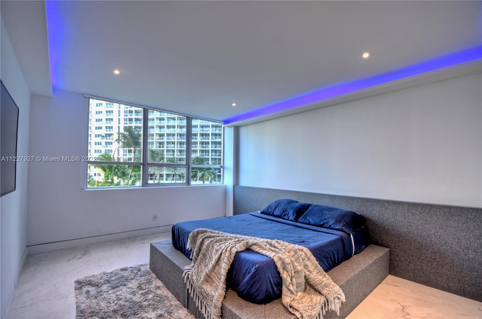 1500 Bay Road, Unit 364S Miami Beach, FL 33139 - Photo 13 of 28 a bedroom with a bed and a window