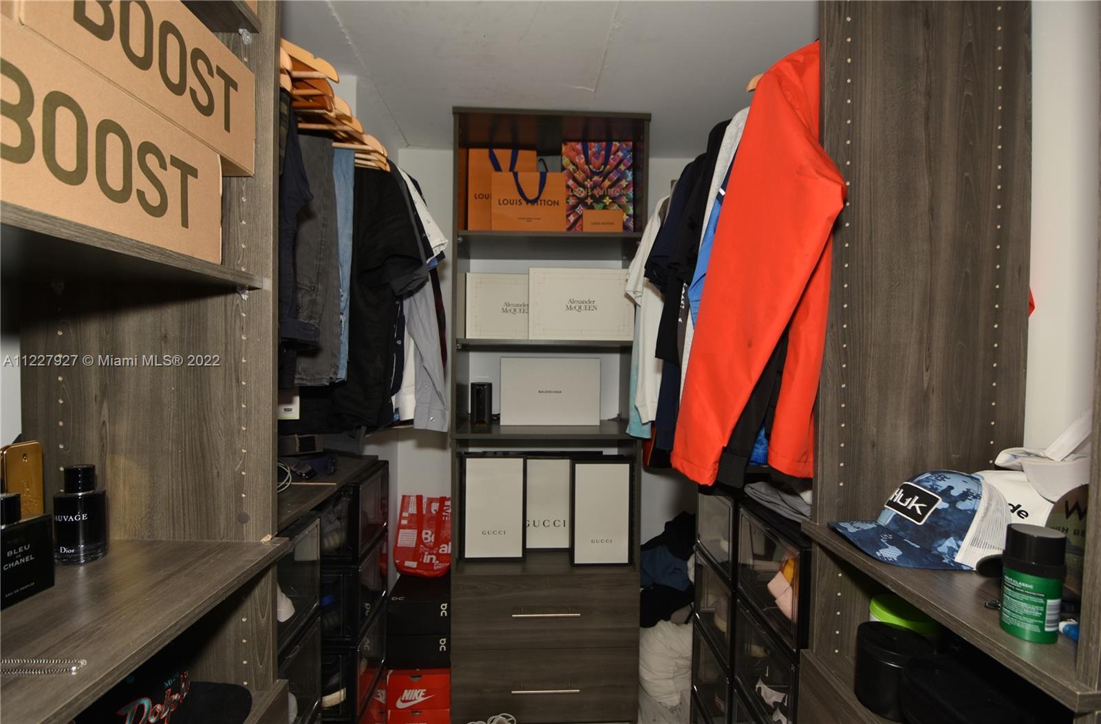 1500 Bay Road, Unit 364S Miami Beach, FL 33139 - Photo 17 of 28 a view of walk in closet with clothes and shoes