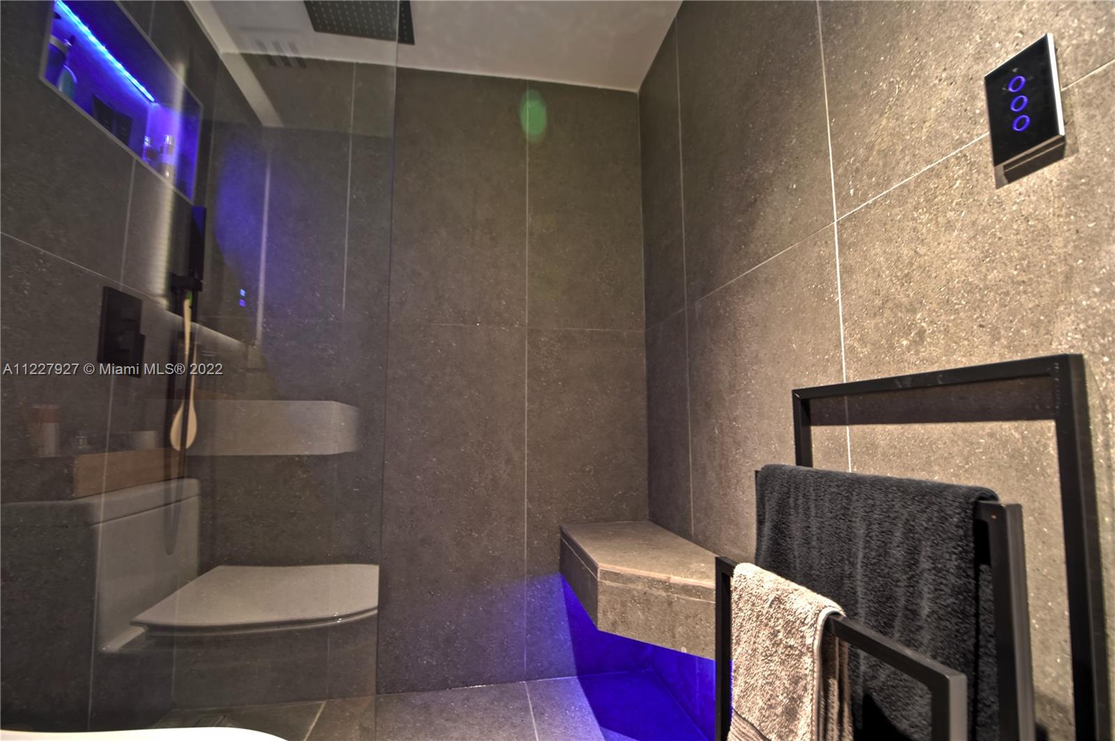 1500 Bay Road, Unit 364S Miami Beach, FL 33139 - Photo 19 of 28 a bathroom with a toilet and a shower