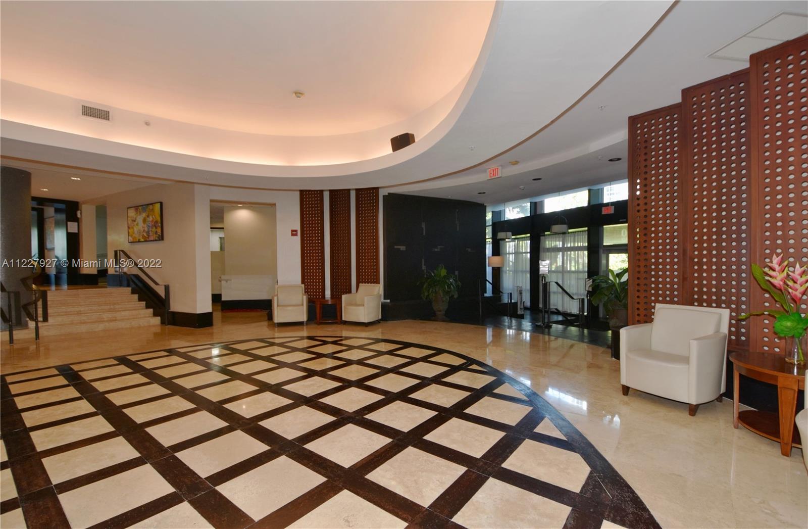 1500 Bay Road, Unit 364S Miami Beach, FL 33139 - Photo 26 of 28 a bedroom with a bed and glass door