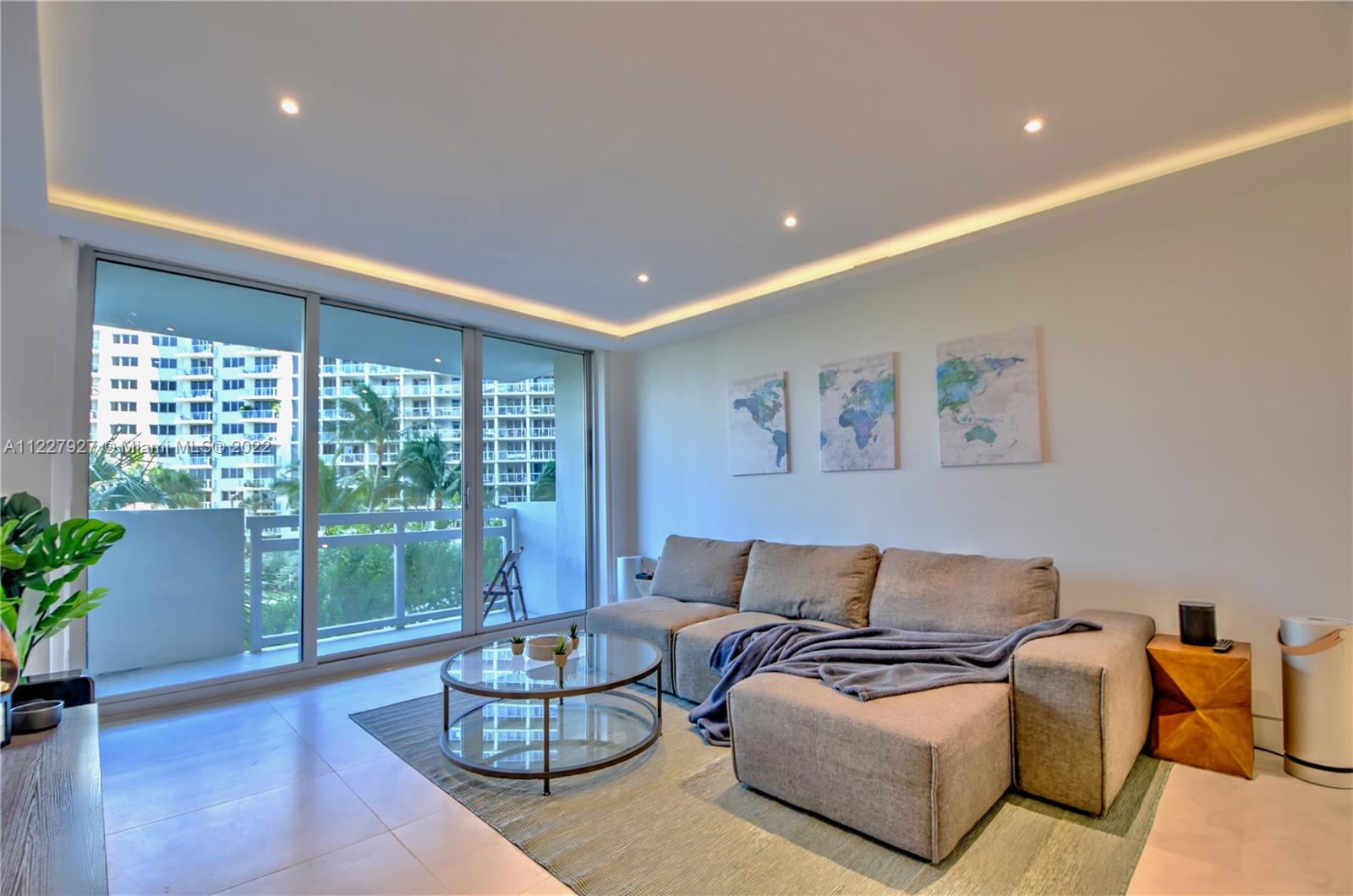 1500 Bay Road, Unit 364S Miami Beach, FL 33139 - Photo 5 of 28 a living room with furniture and a large window