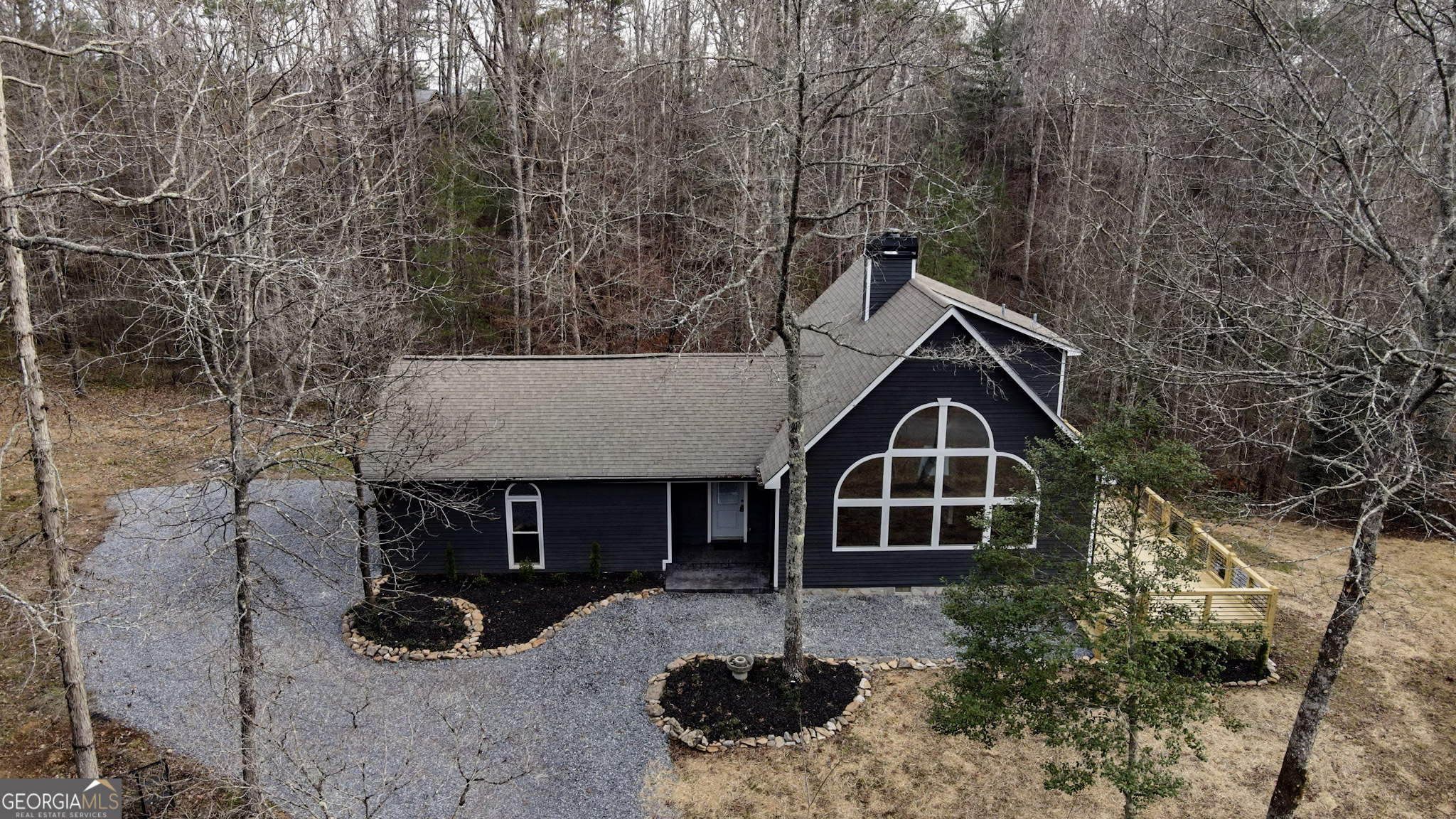 a front view of a house with parking space