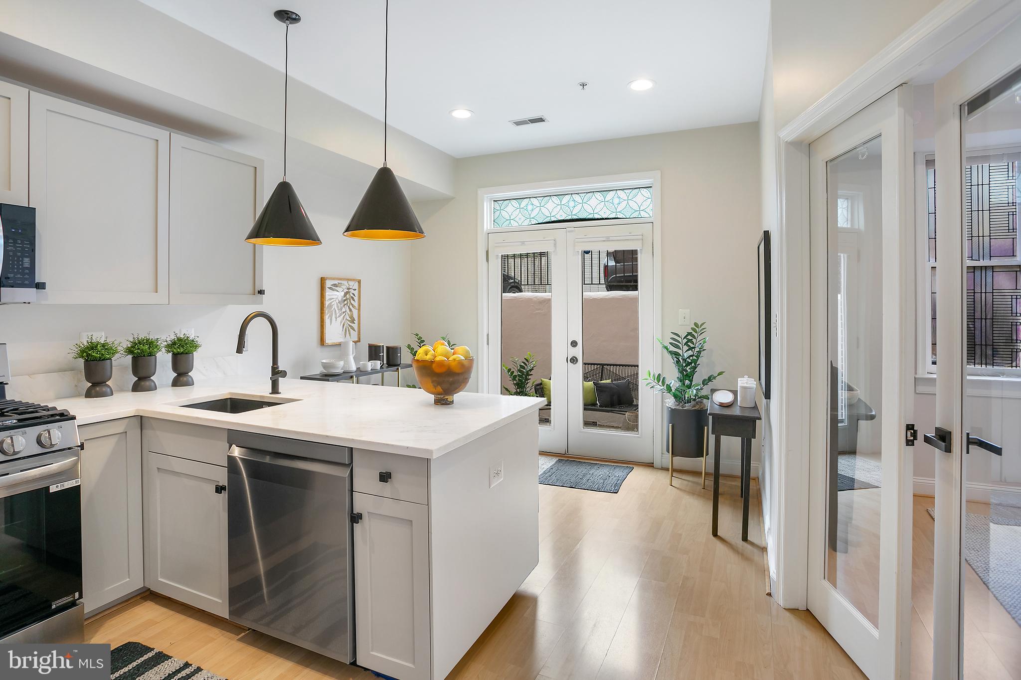 27 Logan Circle Northwest, Unit 5 Washington, DC 20005 - Photo 10 of 35 Kitchen accessible to outdoors and Den