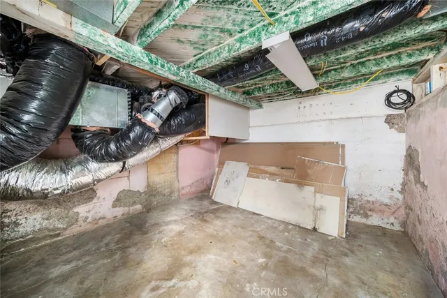 a view of a livingroom with a ceiling fan and window