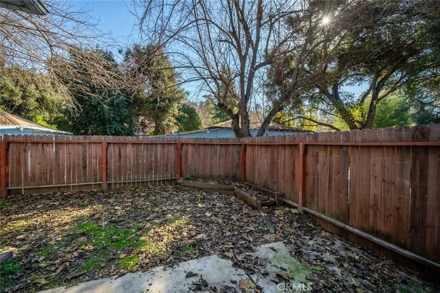 a kitchen with a refrigerator and a stove top oven
