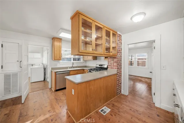 a kitchen with stainless steel appliances granite countertop a stove and a sink