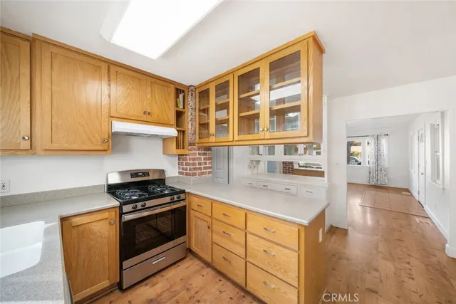 a kitchen with a refrigerator and cabinets