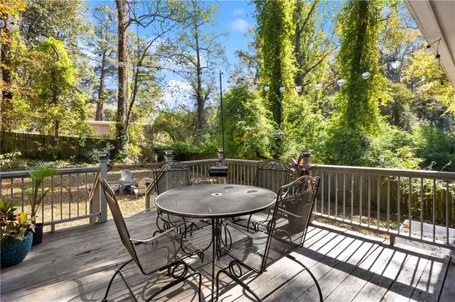 a kitchen with stainless steel appliances kitchen island granite countertop a refrigerator and a stove top oven