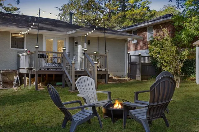 a balcony with table and chairs
