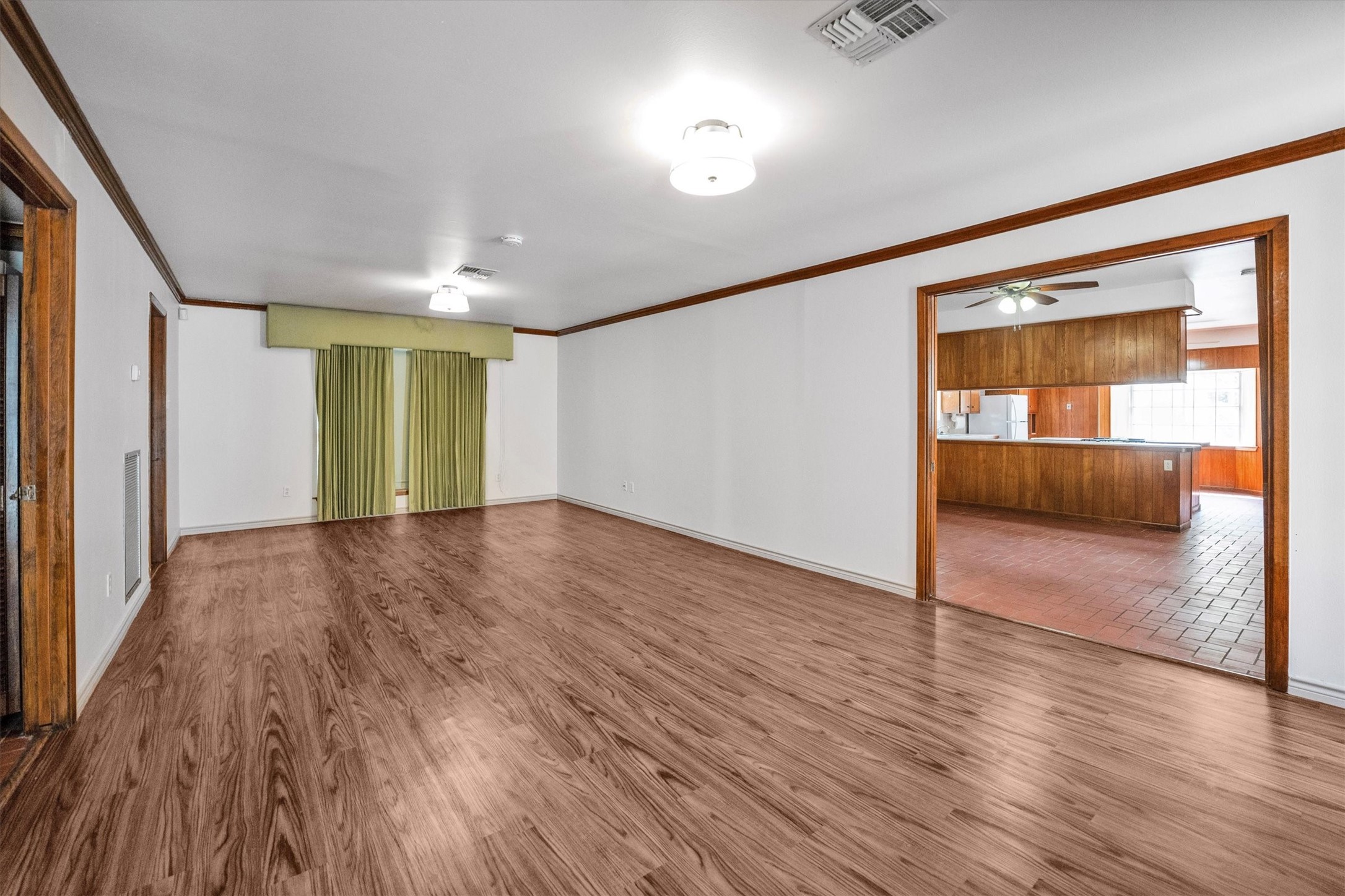 1417 15th Street Huntsville, TX 77340 - Photo 14 of 45 a view of room with wooden floor and window