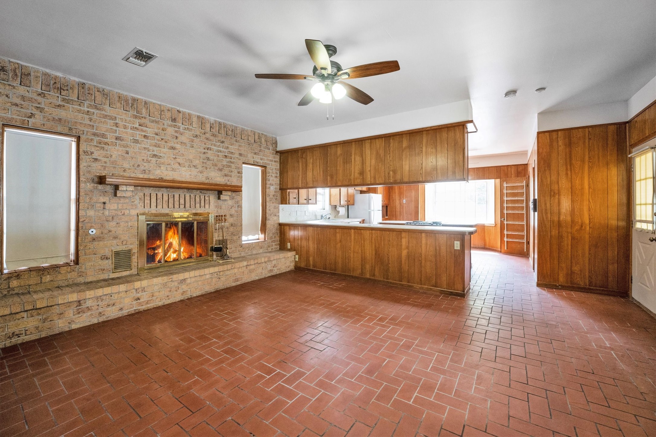 1417 15th Street Huntsville, TX 77340 - Photo 15 of 45 a view of an empty room with a fireplace and a window