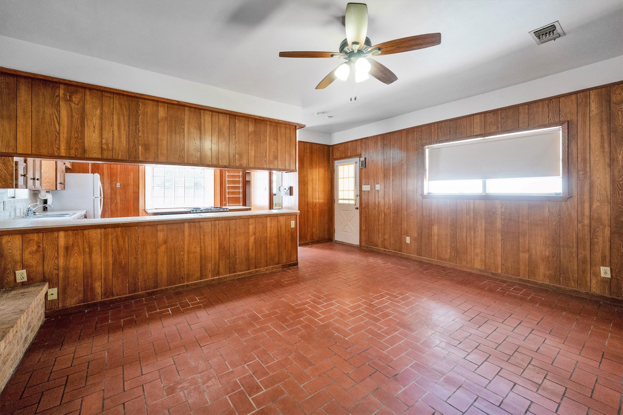 1417 15th Street Huntsville, TX 77340 - Photo 16 of 45 an empty room with windows and fan