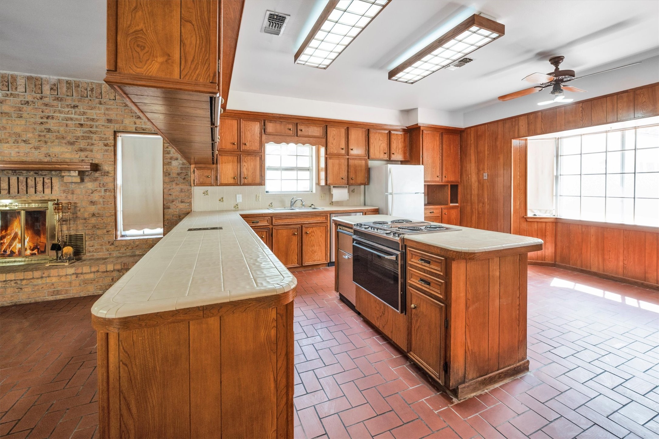 1417 15th Street Huntsville, TX 77340 - Photo 18 of 45 a kitchen with stainless steel appliances granite countertop a stove a sink dishwasher and a refrigerator