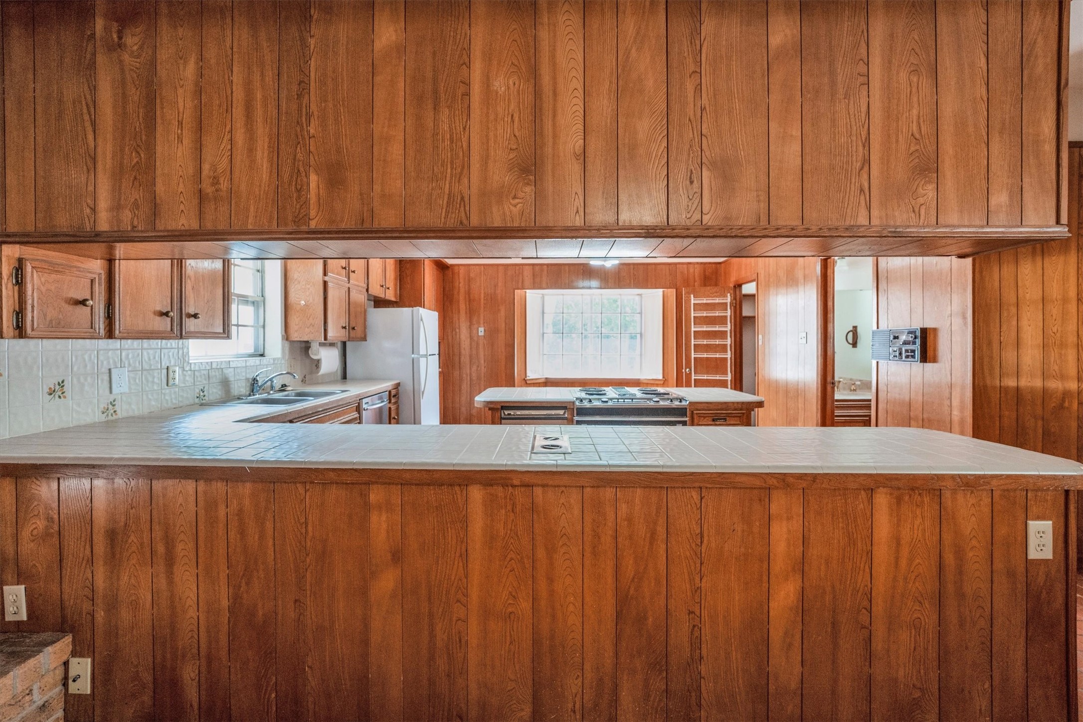 1417 15th Street Huntsville, TX 77340 - Photo 20 of 45 a view of kitchen and wooden cabinet