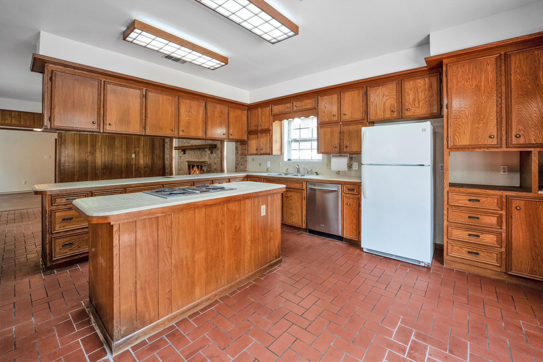 1417 15th Street Huntsville, TX 77340 - Photo 24 of 45 a kitchen with stainless steel appliances granite countertop a refrigerator a stove a sink and a microwave