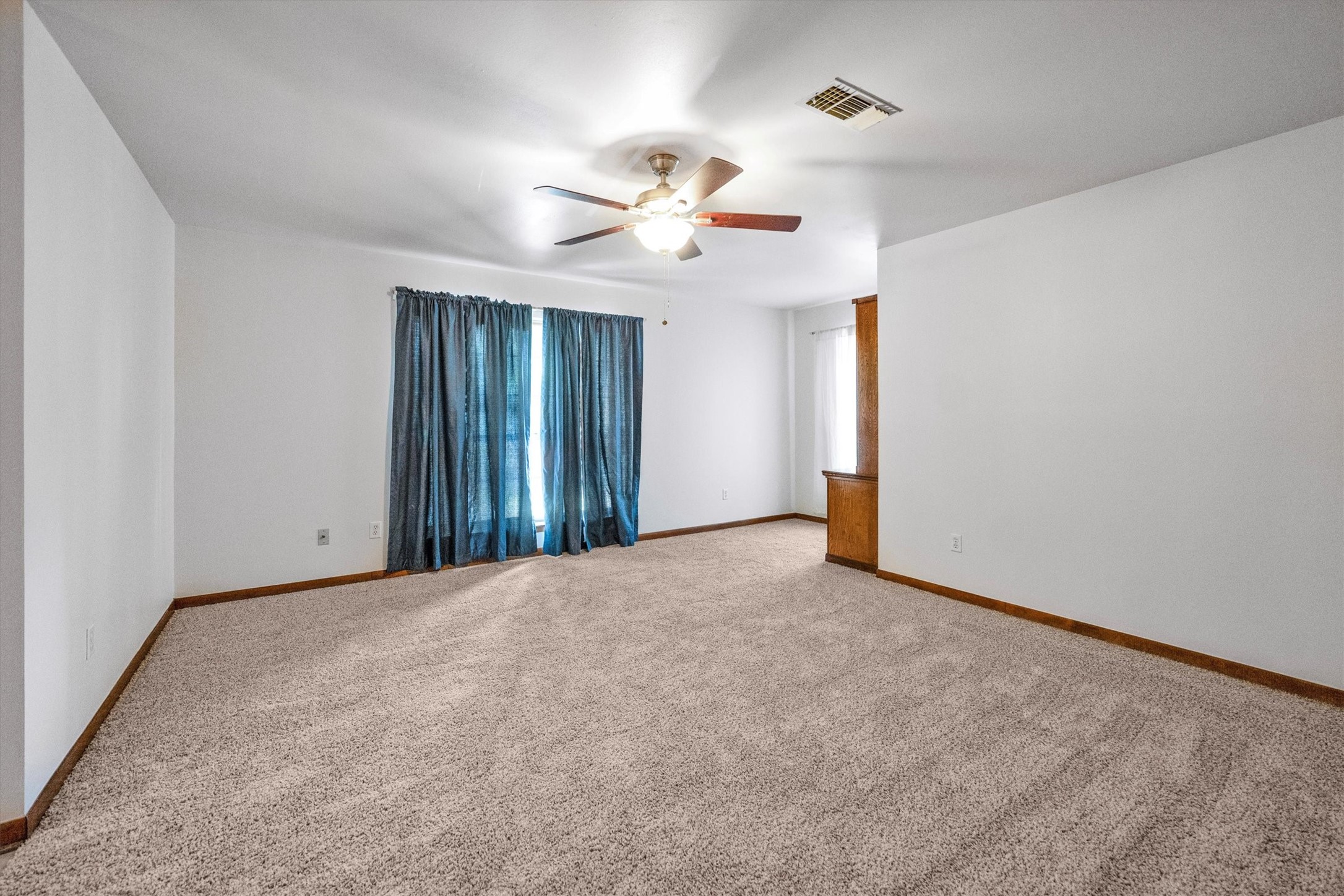 1417 15th Street Huntsville, TX 77340 - Photo 27 of 45 a view of an empty room with a window