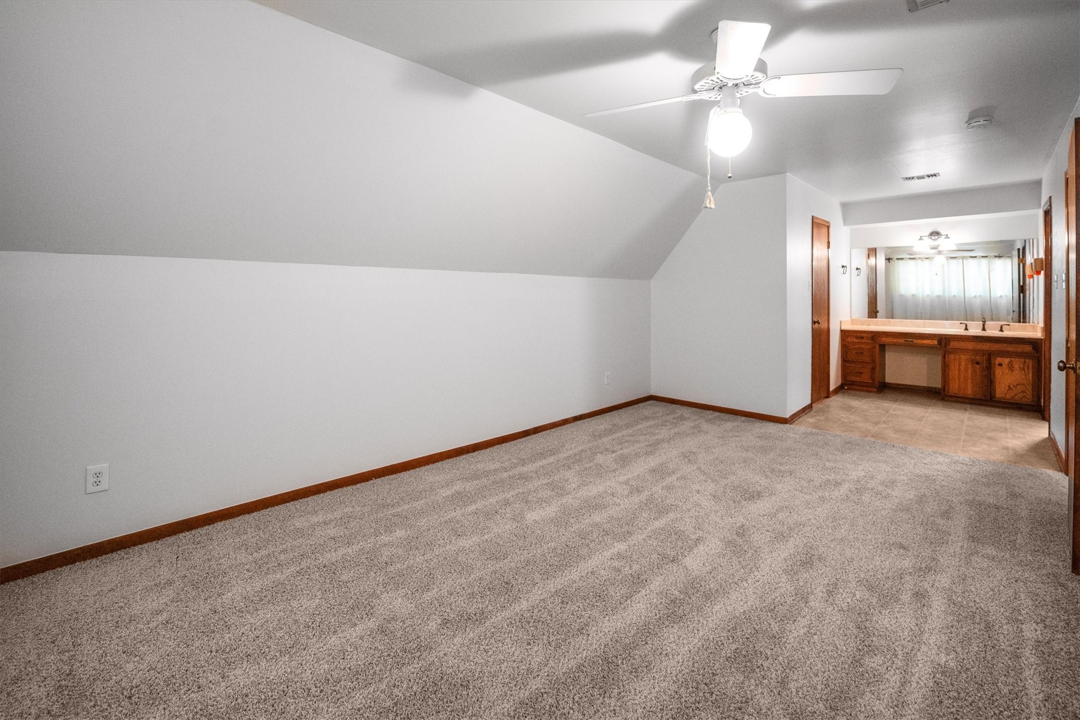 1417 15th Street Huntsville, TX 77340 - Photo 29 of 45 an empty room with chandelier fan and windows