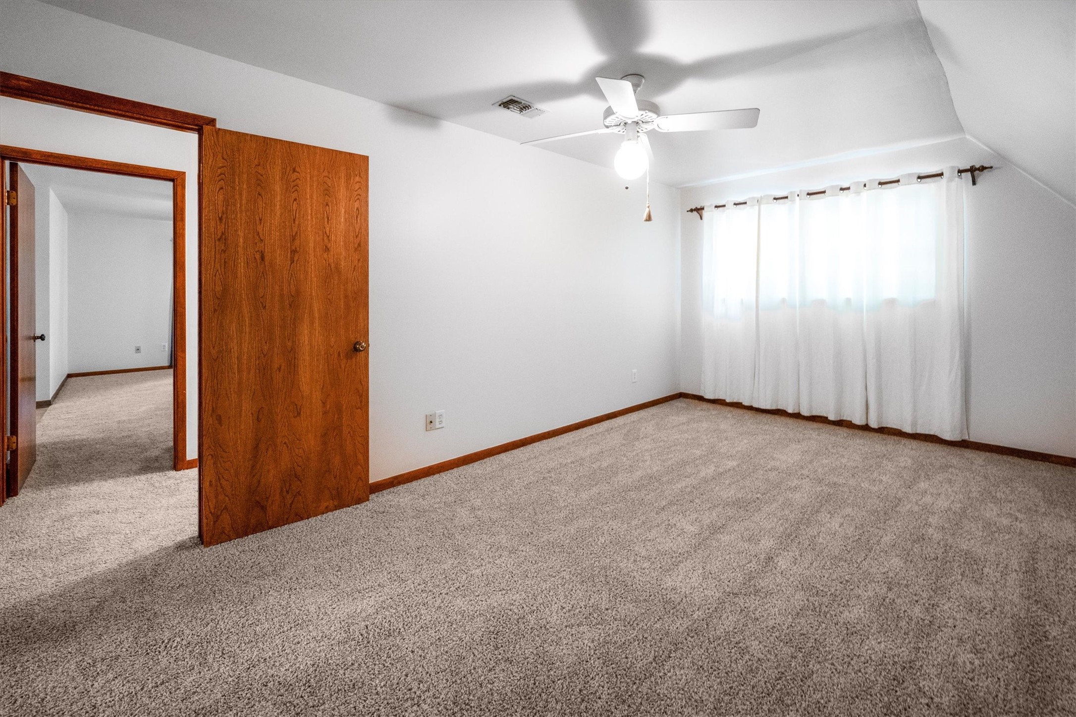 1417 15th Street Huntsville, TX 77340 - Photo 34 of 45 an empty room with windows and fan