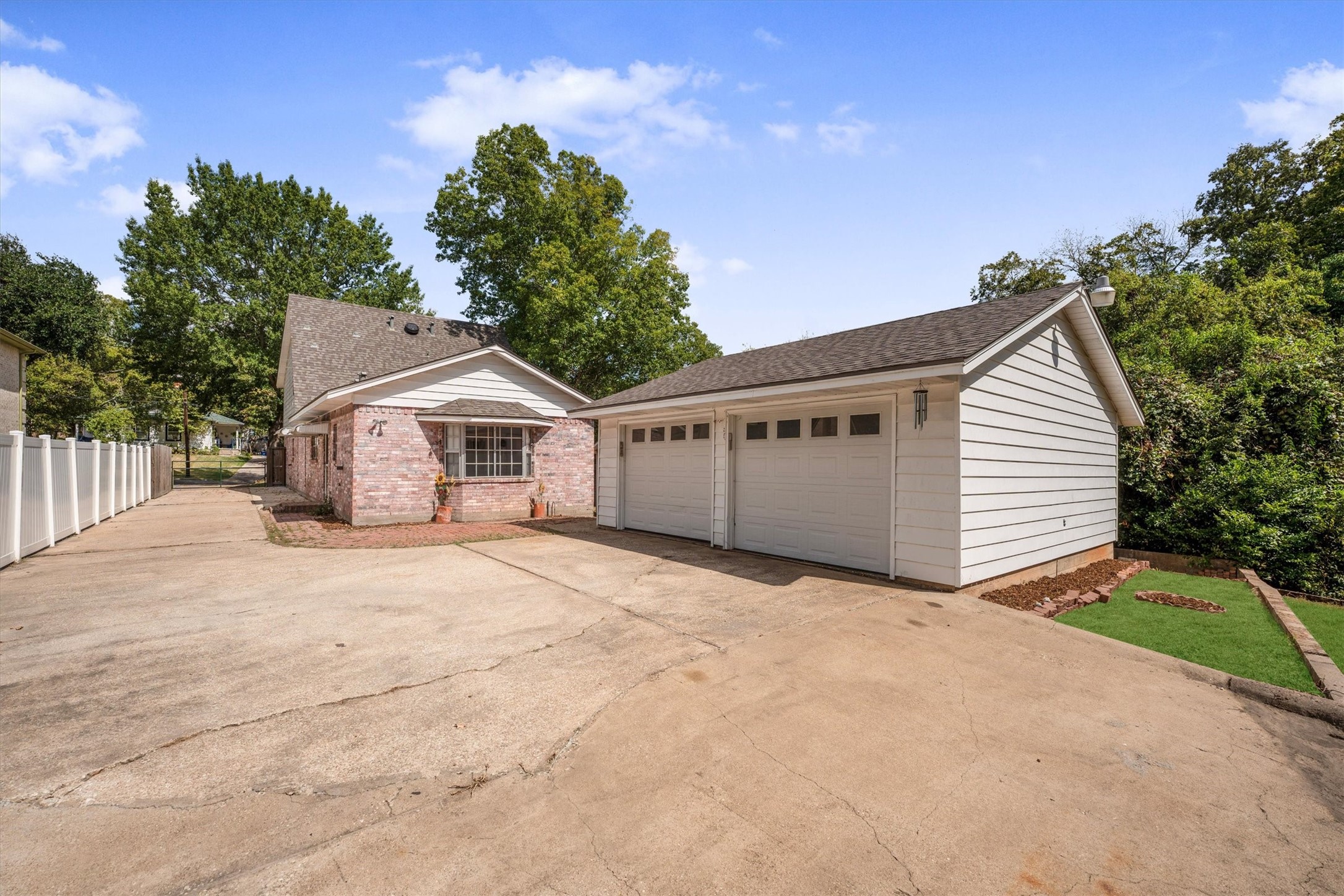 1417 15th Street Huntsville, TX 77340 - Photo 41 of 45 a view of a house with a yard and garage