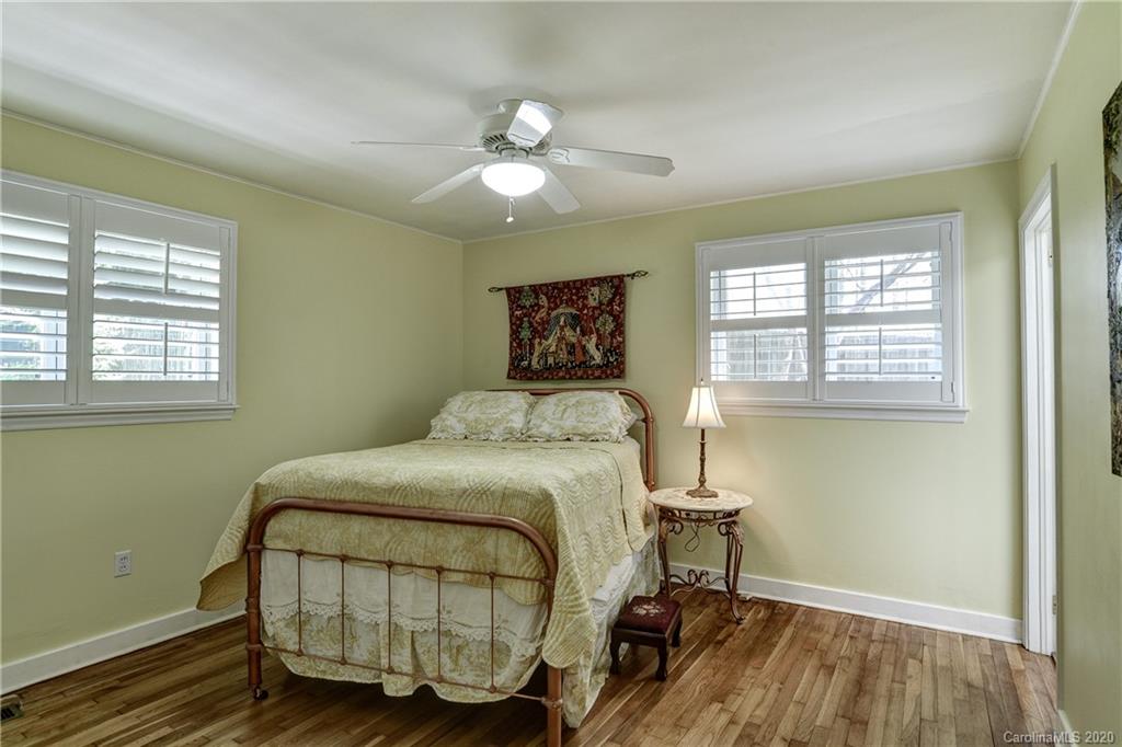 215 Rutledge Drive Hendersonville, NC 28739 - Photo 24 of 31 a bedroom with a bed and window