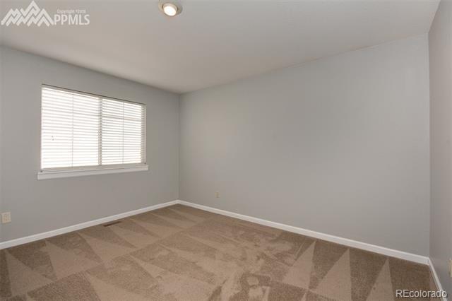 6150 Rabbit Ears Court Colorado Springs, CO 80919 - Photo 18 of 31 an empty room with a window