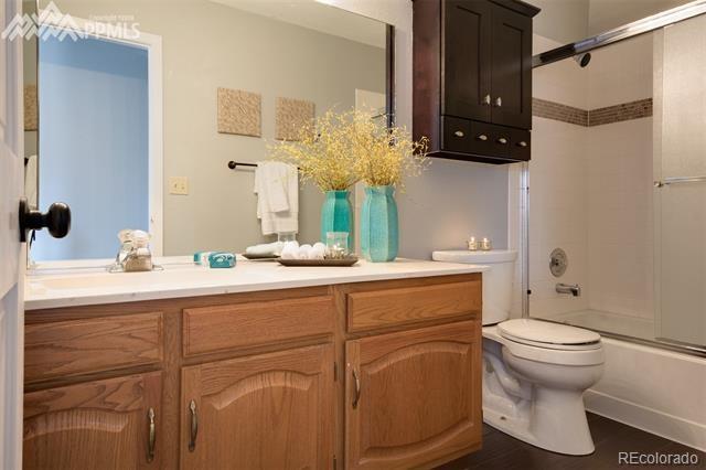 6150 Rabbit Ears Court Colorado Springs, CO 80919 - Photo 19 of 31 a bathroom with a sink toilet and shower