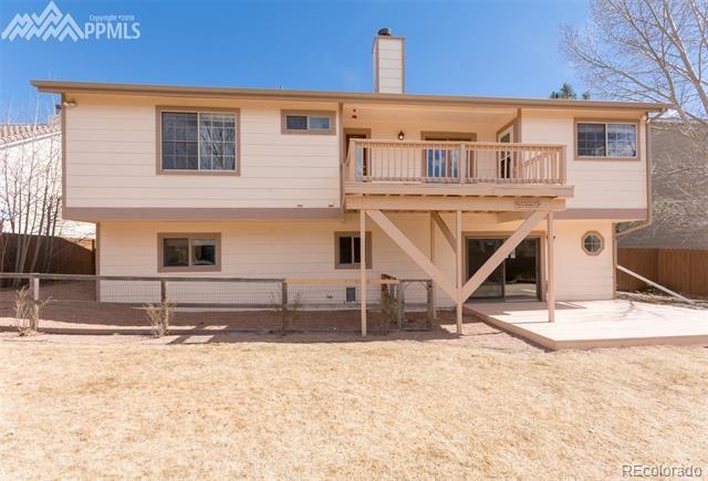 6150 Rabbit Ears Court Colorado Springs, CO 80919 - Photo 29 of 31 a view of a house with snow on the wall