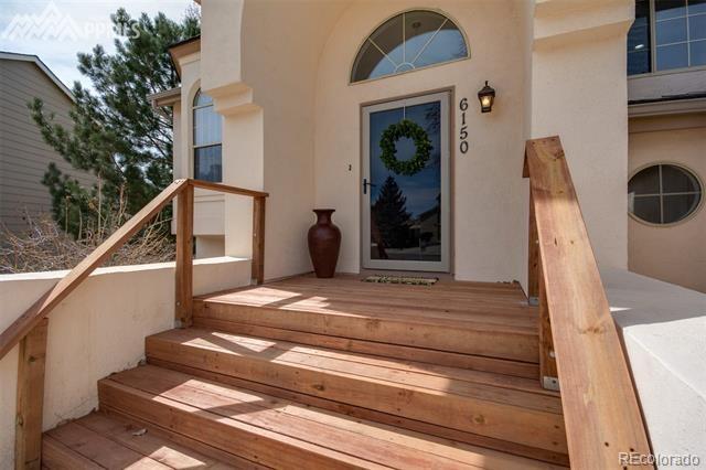 6150 Rabbit Ears Court Colorado Springs, CO 80919 - Photo 3 of 31 a view of entryway with a front door
