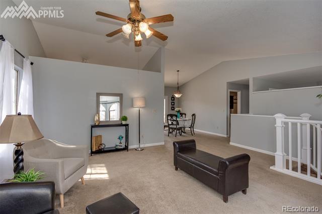 6150 Rabbit Ears Court Colorado Springs, CO 80919 - Photo 7 of 31 a living room with furniture