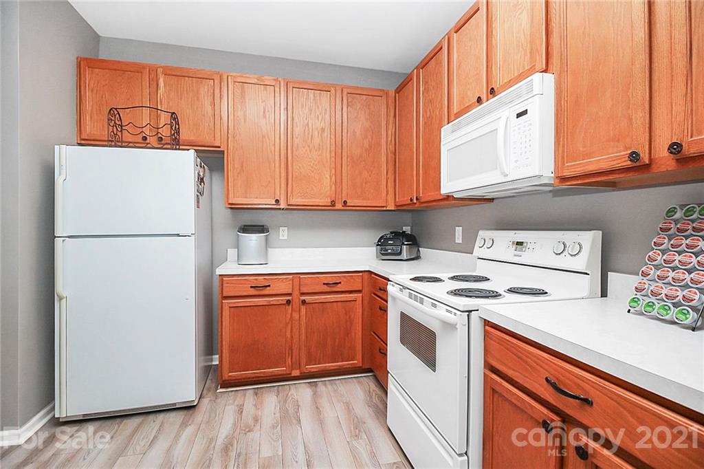 911 Azurine Circle, Unit 74 Fort Mill, SC 29708 - Photo 14 of 40 a kitchen with a refrigerator and a stove
