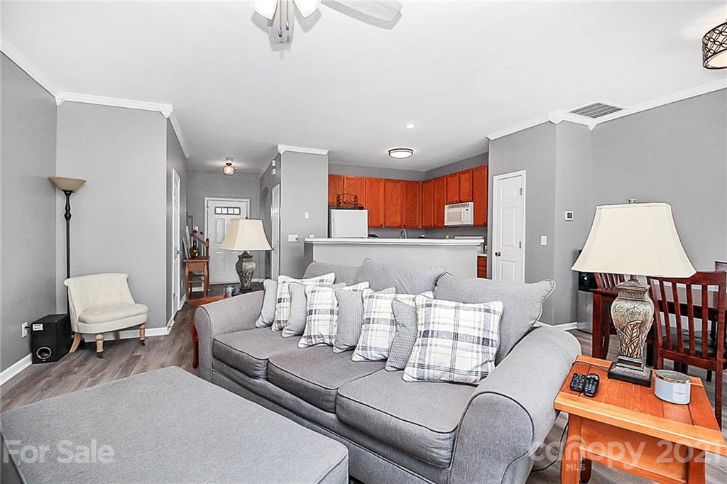 911 Azurine Circle, Unit 74 Fort Mill, SC 29708 - Photo 21 of 40 a living room with furniture and a lamp