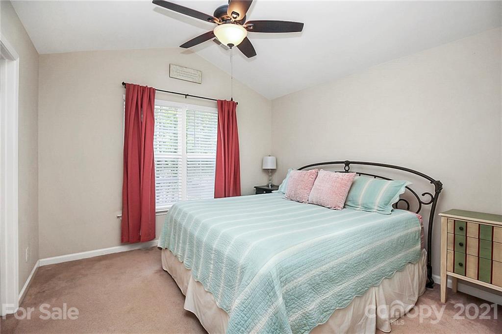 911 Azurine Circle, Unit 74 Fort Mill, SC 29708 - Photo 23 of 40 a bedroom with a bed and window