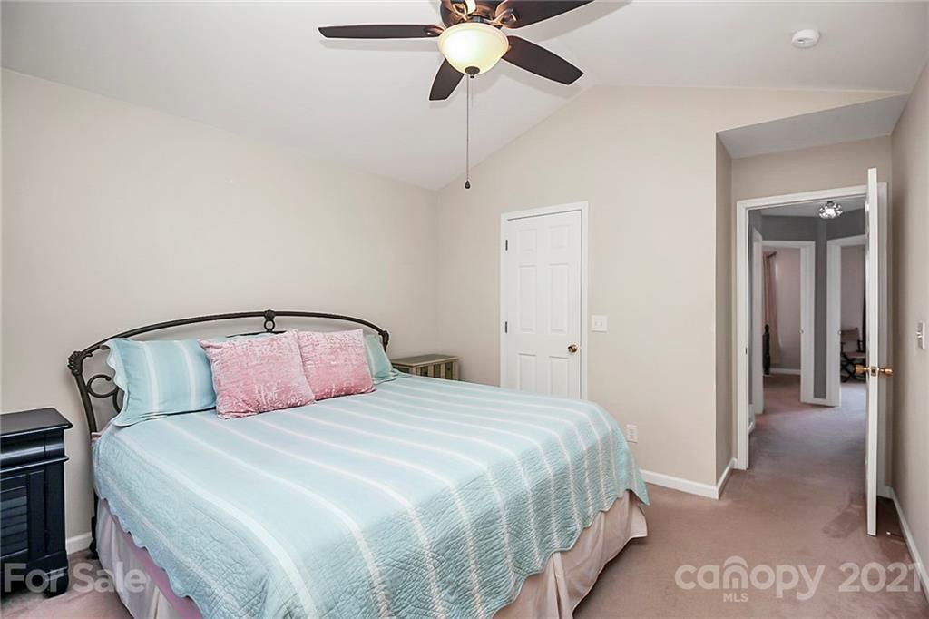 911 Azurine Circle, Unit 74 Fort Mill, SC 29708 - Photo 24 of 40 a bedroom with a beds and ceiling fan
