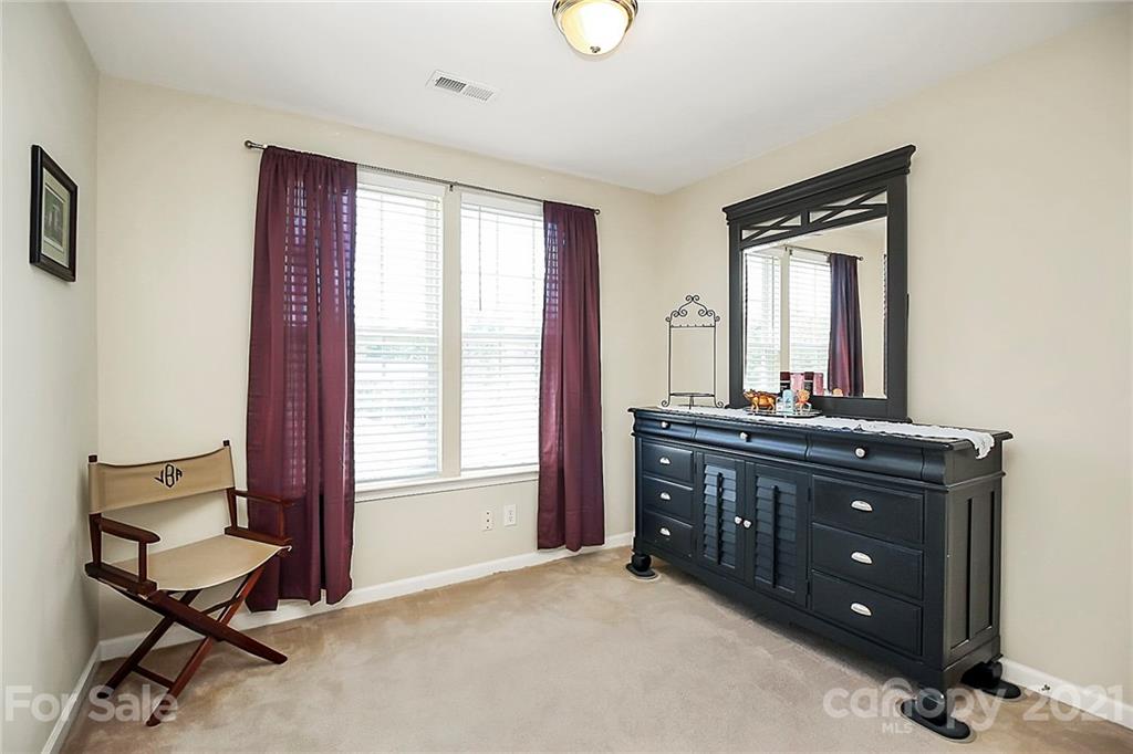 911 Azurine Circle, Unit 74 Fort Mill, SC 29708 - Photo 31 of 40 a room with a dresser and a window