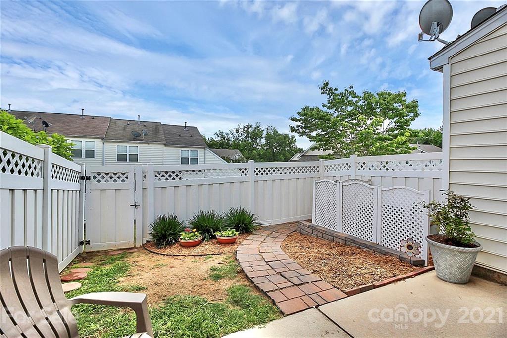 911 Azurine Circle, Unit 74 Fort Mill, SC 29708 - Photo 35 of 40 a view of a backyard with plants