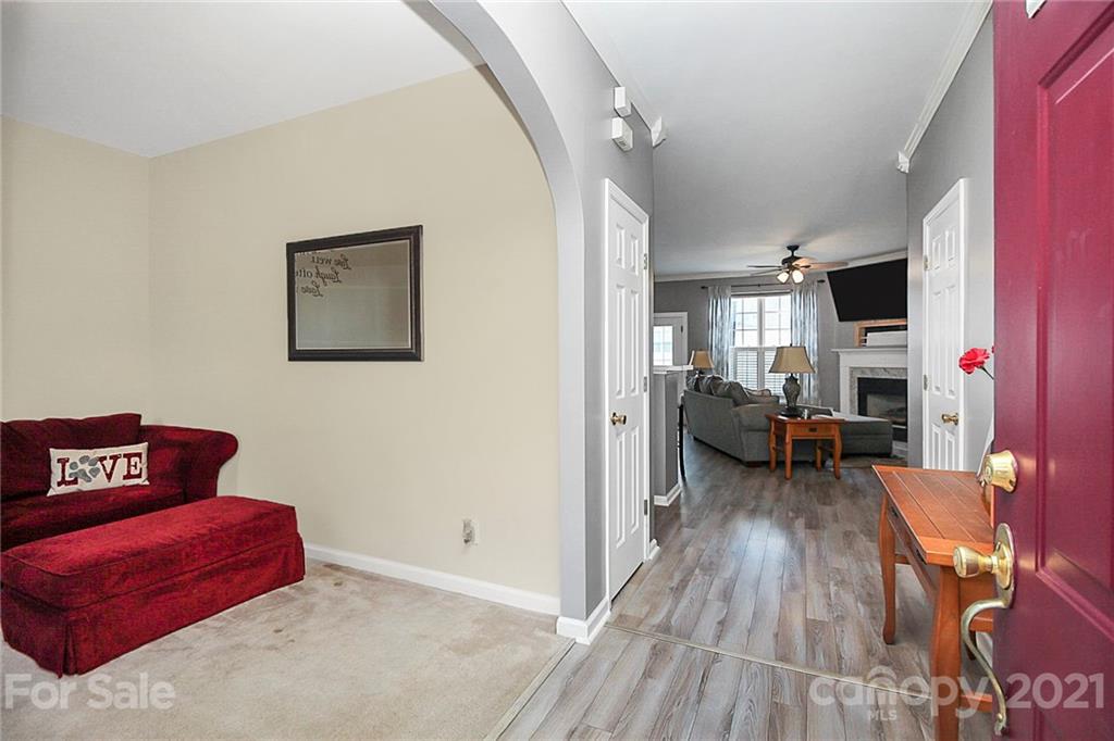 911 Azurine Circle, Unit 74 Fort Mill, SC 29708 - Photo 5 of 40 a living room with furniture and a wooden floor