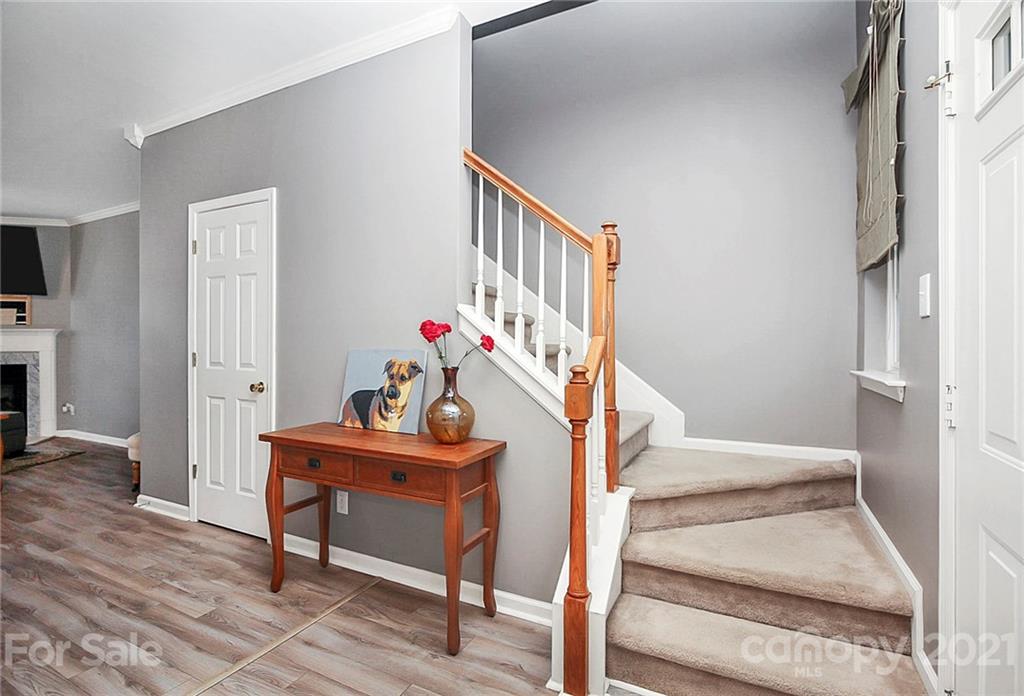 911 Azurine Circle, Unit 74 Fort Mill, SC 29708 - Photo 8 of 40 a view of entryway with wooden floor and stairs