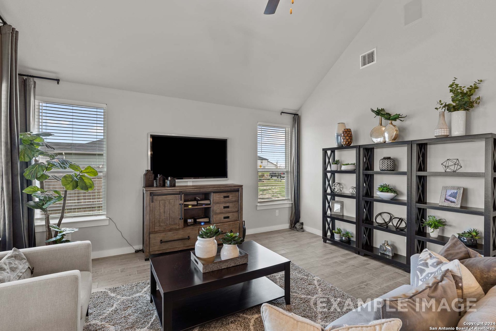 401 Tims Way Seguin, TX 78155 - Photo 17 of 50 a living room with furniture and a flat screen tv