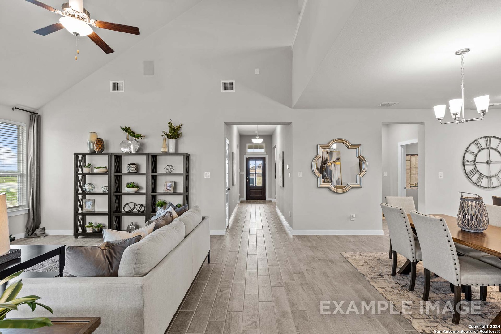 401 Tims Way Seguin, TX 78155 - Photo 18 of 50 a living room with furniture a chandelier and a wooden floor