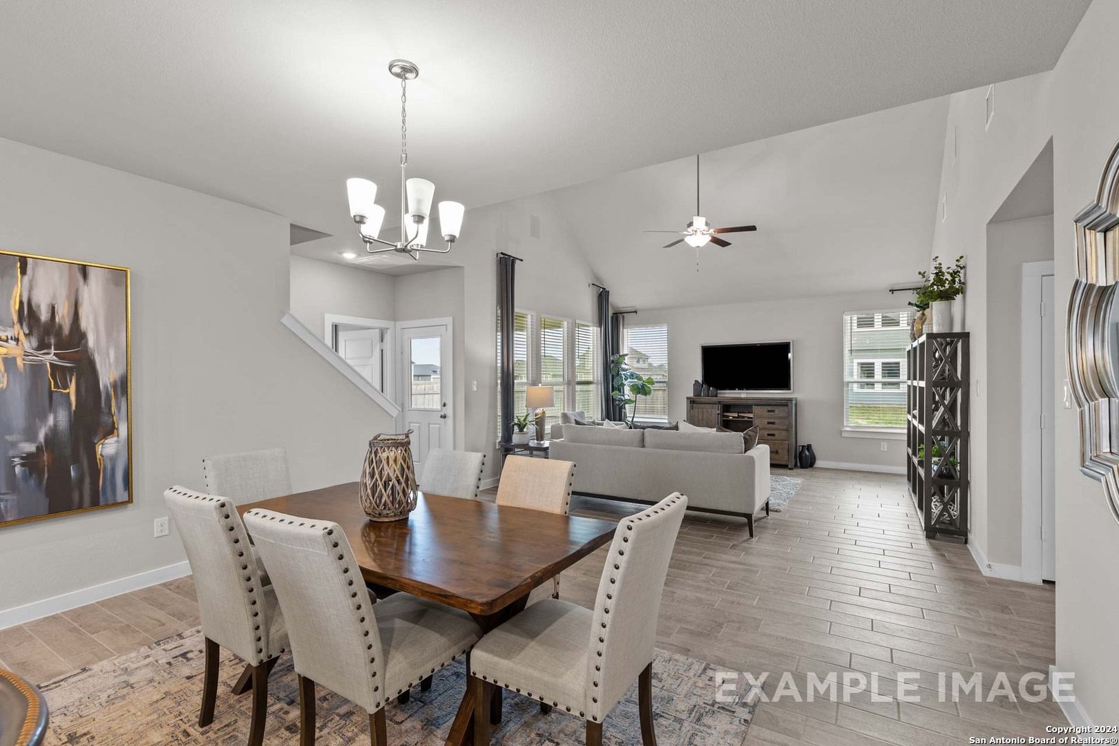 401 Tims Way Seguin, TX 78155 - Photo 22 of 50 a view of a dining room with furniture a chandelier and wooden floor