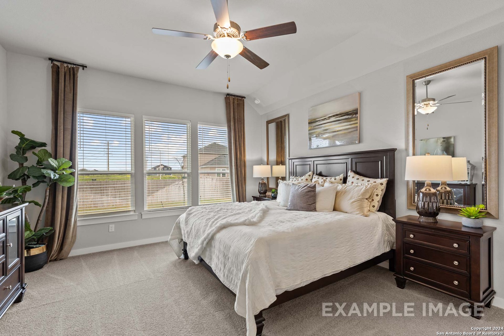 401 Tims Way Seguin, TX 78155 - Photo 32 of 50 a bedroom with a bed and a chandelier