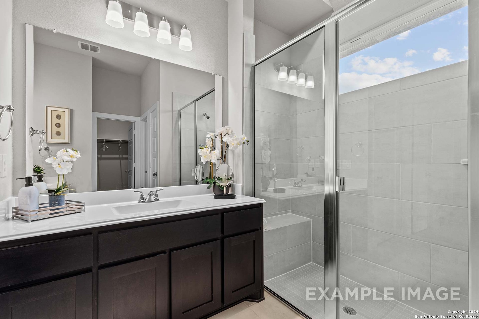 401 Tims Way Seguin, TX 78155 - Photo 36 of 50 a bathroom with a double vanity sink mirror and shower