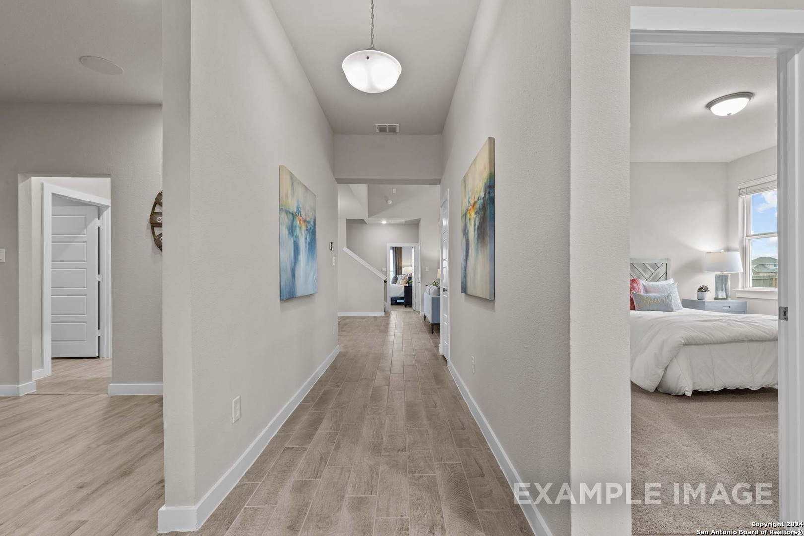 401 Tims Way Seguin, TX 78155 - Photo 4 of 50 a view of a hallway with wooden floor and furniture