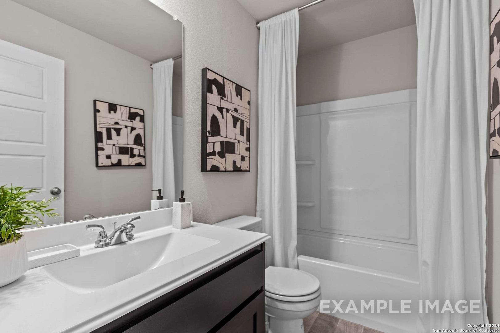 401 Tims Way Seguin, TX 78155 - Photo 45 of 50 a bathroom with a sink and a mirror