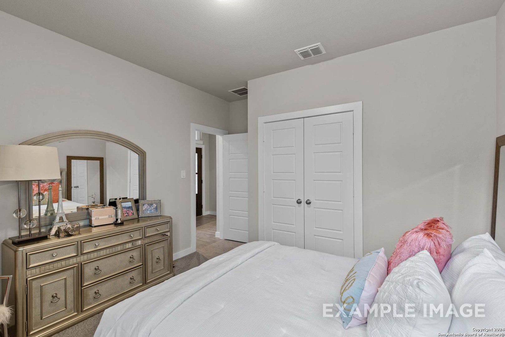 401 Tims Way Seguin, TX 78155 - Photo 48 of 50 a bedroom with a bed and a dresser