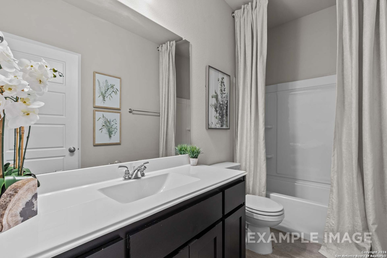 401 Tims Way Seguin, TX 78155 - Photo 49 of 50 a bathroom with a sink a toilet and shower