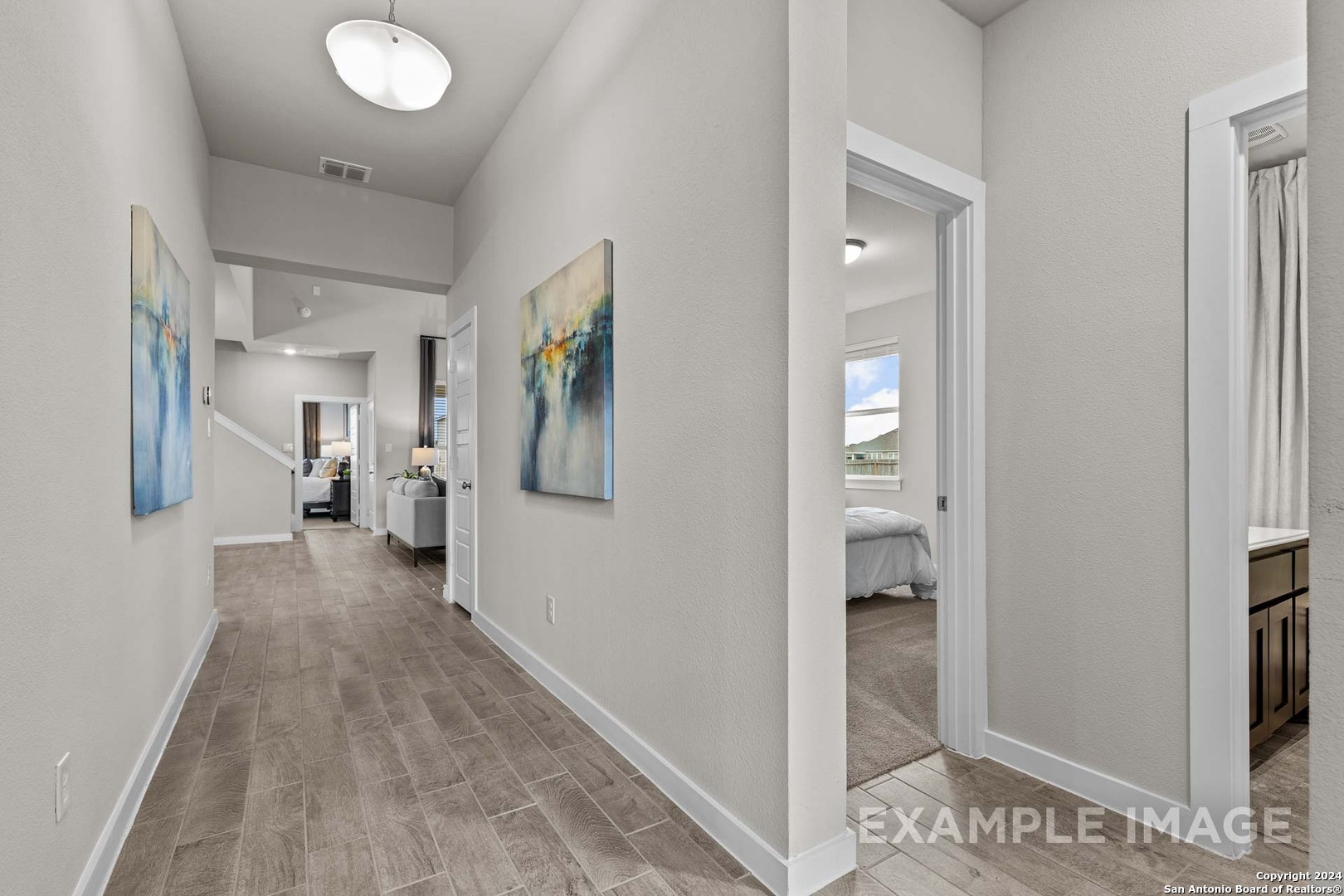 401 Tims Way Seguin, TX 78155 - Photo 6 of 50 a view of a hallway with wooden floor and living room