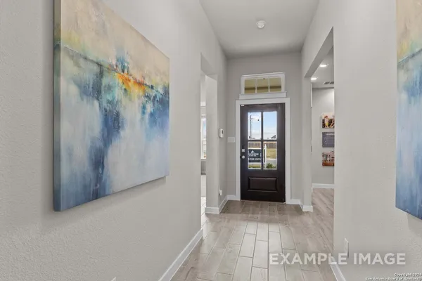 a view of a dining area with furniture and a kitchen